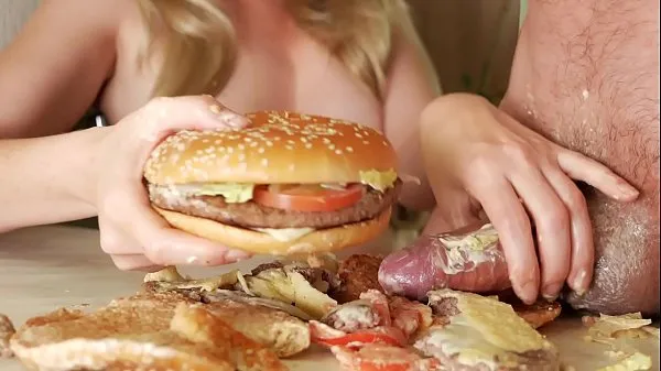 fuck burger. the girl jerks off the guy's dick with a burger. Sperm pouring onto the steak. really favorite burger Total Video yang besar
